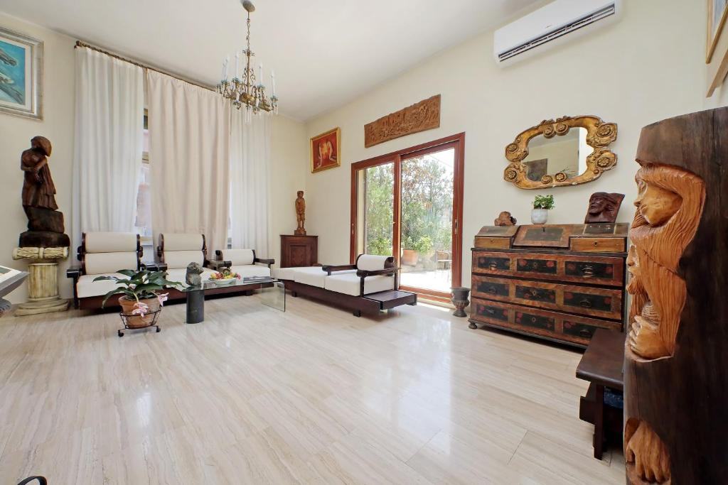 Carved wooden sculptures displayed in the living room
